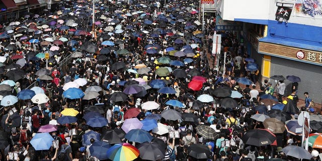 Protesters rally in Yuen Long in Hong Kong Saturday, July 27, 2019. Thousands of protesters began marching Saturday despite police warnings that their presence would spark confrontations with local residents. Demonstrators wearing black streamed through Yuen Long, the area where a mob brutally attacked people in a commuter rail station last Sunday.