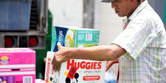 Volunteers unloading the truck of supplies at respite center in McAllen, Texas.