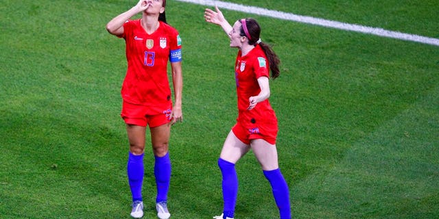 United States' Alex Morgan, left, celebrates her side's second goal during the Women's World Cup semifinal soccer match between England and the United States, at the Stade de Lyon, Tuesday, July 2.
