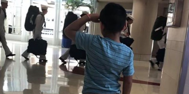 Jace Vega is going viral online for a photo of the six-year-old saluting members of the military at San Antonio International Airport. (Priscilla Pinales-Vega & Joe Vega)