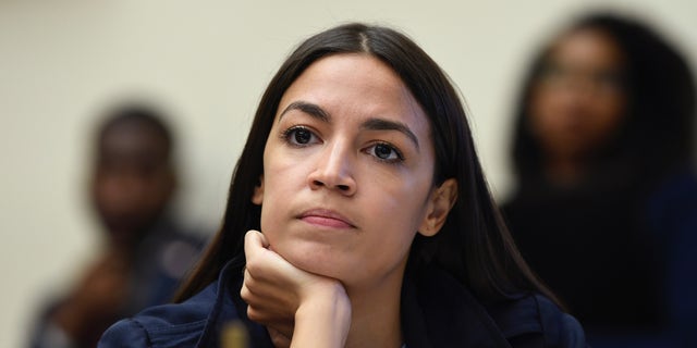 Rep. Alexandria Ocasio-Cortez, D-N.Y., has blamed McConnell for 'Team Mitch' staffers posing with a cardboard cutout of her. (AP Photo/Susan Walsh)