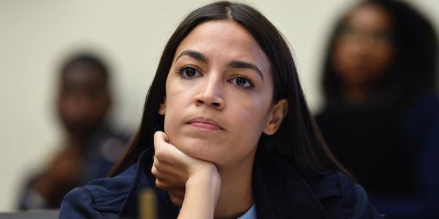 Rep. Alexandria Ocasio-Cortez, D-N.Y., has blamed McConnell for 'Team Mitch' staffers posing with a cardboard cutout of her. (AP Photo/Susan Walsh)
