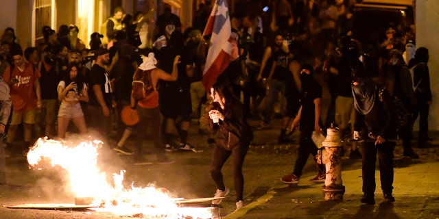 Clashes between demonstrators and riot control units.