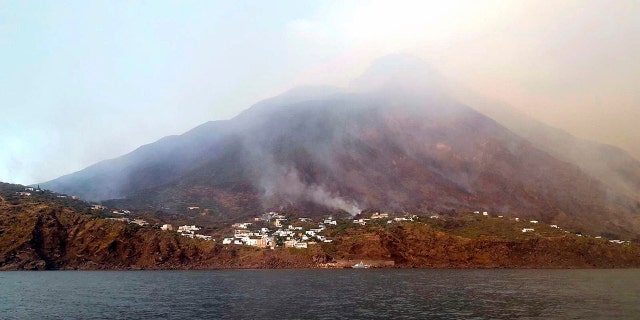 Smoke billows from the volcano on the Italian island of Stromboli, Wednesday, July 3, 2019. The news agency ANSA says that some 30 tourists jumped into the sea out of fear after a series of volcano erupted on the Sicilian island of Stromboli. Civil protection authorities said it was killed by the eruptions Wednesday. (ANSA VIA)