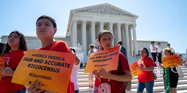 Young demonstrators gather at the Supreme Court as the justices finish the term with key decisions on gerrymandering and a census case involving an attempt by the Trump administration to ask everyone about their citizenship status in the 2020 census, on Capitol Hill in Washington, Thursday, June 27, 2019. (AP Photo/J. Scott Applewhite)