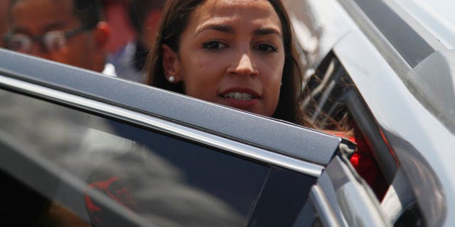 FILE: Rep. Alexandria Ocasio-Cortez, of New York, gets in an SUV after touring the inside of the Border Patrol station in Clint, Texas.