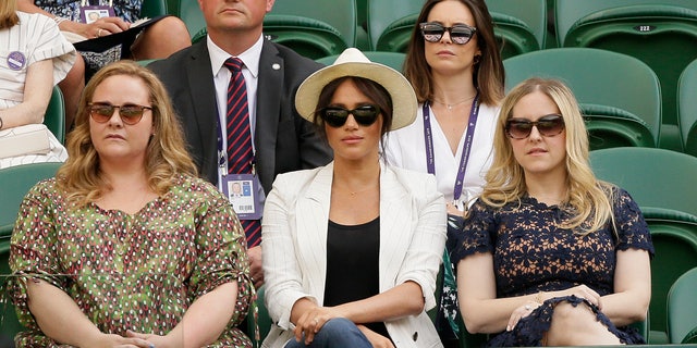The Duchess of Sussex watches Serena Williams play Kaja Juvan in a singles match during day four of the Wimbledon Tennis Championships. (AP Photo/Tim Ireland)