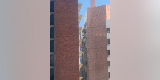The aftermath of an explosion inside a residence hall at the University of Nevada, Reno in Reno, Nev., is visible on Friday. Police referred to the incident as a "utilities accident." (Raymond Floyd via The AP)