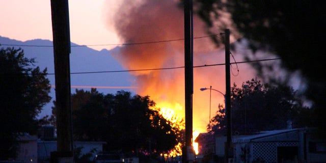 Smoke rises from a fire that broke out behind the Casa Corona restaurant following an earthquake in Ridgecrest, Calif., Friday, July 5, 2019. (Associated Press)