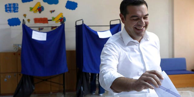 Syriza Greek Prime Minister and Party leader Alexis Tsipras gives his vote at a polling station on Sunday, July 7, 2019 in Athens.