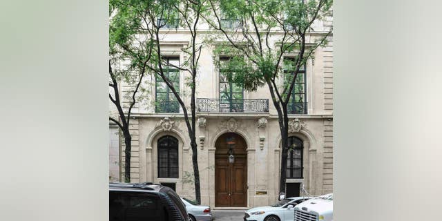 This photo shows the Manhattan residence of Jeffrey Epstein, Monday July 8, 2019, in New York. Prosecutors said Monday, federal agents investigating wealthy sex offender Jeffrey Epstein found "nude photographs of what appeared to be underage girls" while searching his Manhattan mansion. (AP Photo/Bebeto Matthews)