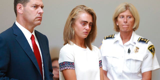 CASE REPORT: Michelle Carter, center, listens to her manslaughter conviction for inciting 18-year-old Conrad Roy III to kill herself in July 2014. 