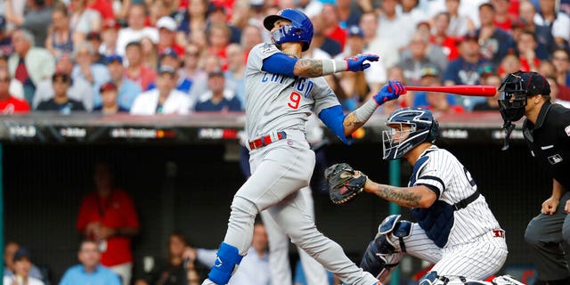 National League Javier Baez of the Chicago Cubs swings in the opening round of MLB's all-star baseball game against the American League.