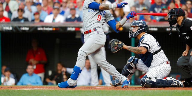National League Javier Baez of the Chicago Cubs swings in the opening round of MLB's all-star baseball game against the American League.