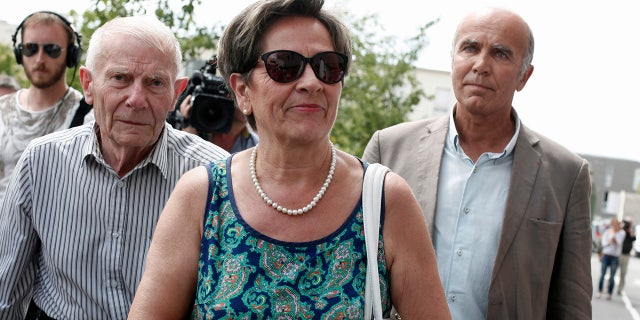 In this July 23, 2015 file photo, Viviane and Pierre Lambert, left, parents of Vincent Lambert, arrive at the Sebastopol hospital, in Reims, eastern France, where Vincent, was on artificial life support.