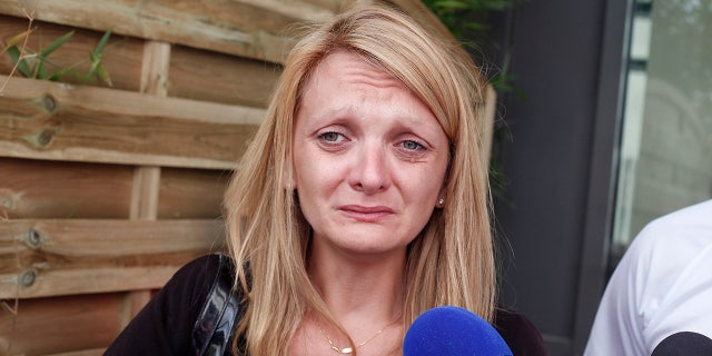 This July 23, 2015, file photo shows Rachel Lambert, wife of Vincent Lambert, crying as she speaks to the media, at the Sebastopol hospital, in Reims, eastern France, where Vincent was on artificial life support.?