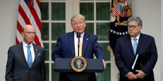 President Donald Trump joined by Commerce Secretary Wilbur Ross and Attorney General William Barr, right, in the Rose Garden on Thursday. (AP Photo/Carolyn Kaster)