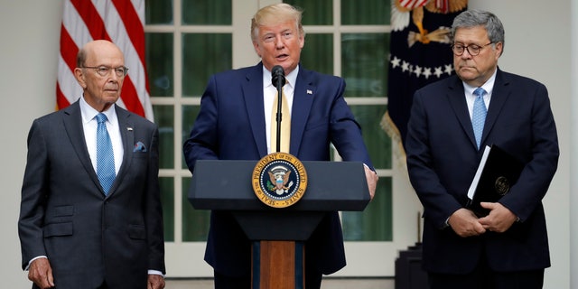 President Donald Trump joined by Commerce Secretary Wilbur Ross and Attorney General William Barr, right, in the Rose Garden on Thursday. (AP Photo/Carolyn Kaster)