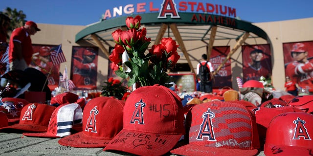 A makeshift shrine in honor of Los Angeles Angels pitcher Tyler Skaggs stands outside Angel Stadium before the team's baseball game against the Seattle Mariners on Friday, July 12, 2019, in Anaheim, Calif. (Associated Press)