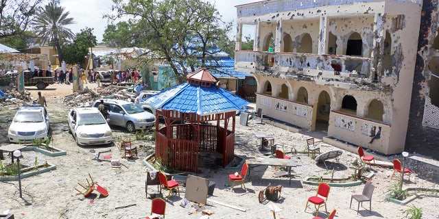 A view of Asasey Hotel after an attack, in Kismayo , Somalia, Saturday July 13, 2019. At least 10 people, including two journalists, were killed in an extremist attack Friday on a hotel in the port city of Kismayo, a Somali official said. The attack started with a suicide car bomb blast and then gunmen stormed into the hotel. (AP Photo)
