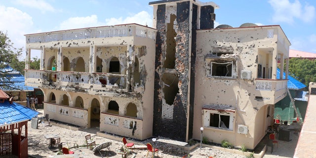 A view of Asasey Hotel after an attack, in Kismayo , Somalia, Saturday July 13, 2019. At least 10 people, including two journalists, were killed in an extremist attack Friday on a hotel in the port city of Kismayo, a Somali official said. The attack started with a suicide car bomb blast and then gunmen stormed into the hotel. (AP Photo)