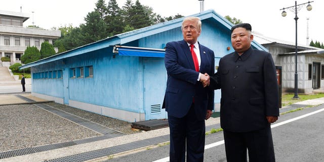 In this June 30, 2019, file photo, President Donald Trump, left, meets with North Korean leader Kim Jong Un at the border village of Panmunjom in the Demilitarized Zone, South Korea.