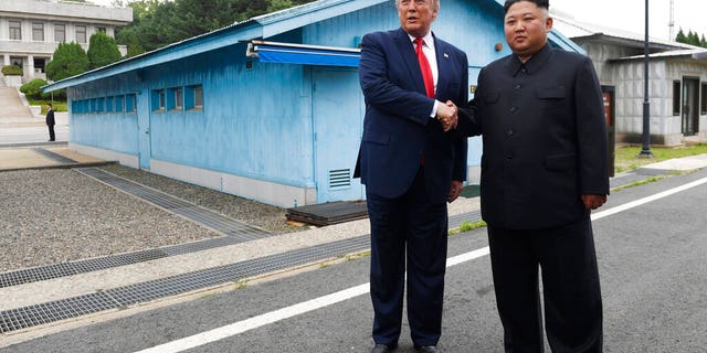 In this June 30, 2019, file photo, President Donald Trump, left, meets with North Korean leader Kim Jong Un at the border village of Panmunjom in the Demilitarized Zone, South Korea.