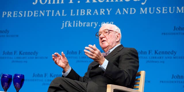 Retired U.S. Supreme Court Justice John Paul Stevens talking about his views and career during a forum at the John F. Kennedy Library in Boston, in 2013. (AP Photo/Michael Dwyer, File)