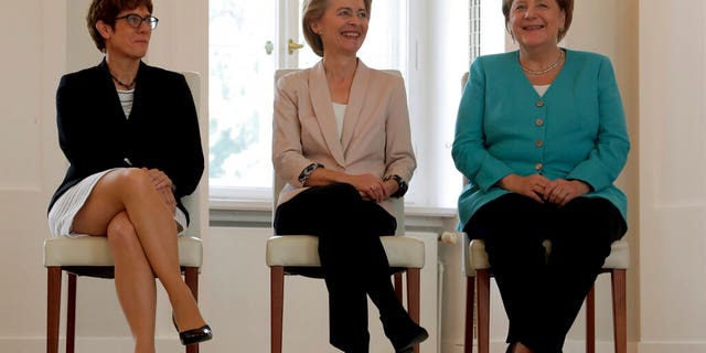 From right, German Chancellor Angela Merkel, new elected European Commission President Ursula von der Leyen and Annegret Kramp-Karrenbauer, von der Leyen's successor as German Defense Minister, attend an office over ceremony at the Bellevue Palace in Berlin, Germany, Wednesday, July 17, 2019.