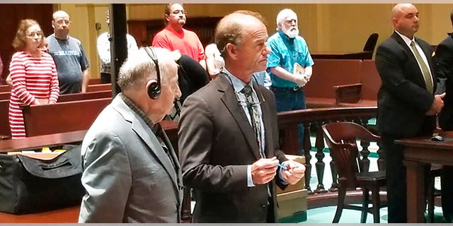 Albert Flick, left, stands beside his defense attorney, Allan Lobozzo, as the jury delivers a guilty verdict at his murder trial in Superior Court on Wednesday, July 17, 2019, in Auburn, Maine. A jury convicted Flick on Wednesday in the 2018 death of 48-year-old Kimberly Dobbie.