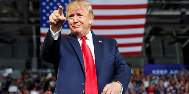 President Donald Trump gestures to the crowd as he arrives to speak at a campaign rally at Williams Arena in Greenville, N.C., Wednesday, July 17, 2019. (Associated Press)