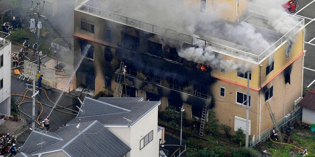 Smoke billows from a three-story building of Kyoto Animation in a fire in Kyoto, western Japan, Thursday, July 18, 2019. 