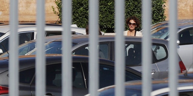 Federica Orlandi, sister of Emanuela Orlandi, who was missing in 1983, is seen on Saturday at the Vatican by the bars of a gate. (AP Photo / Gregorio Borgia)