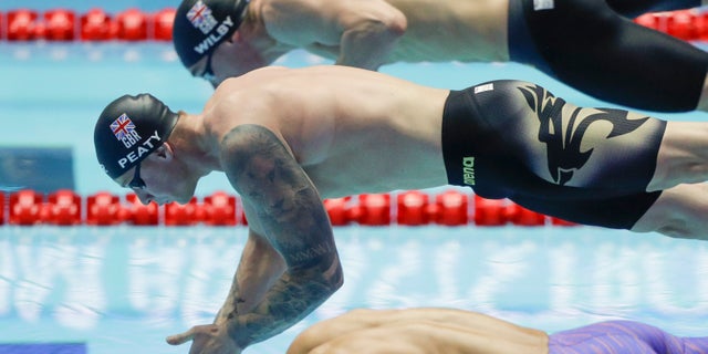 Britain's Adam Peaty starts in the men's 100m breaststroke semifinal at the World Swimming Championships in Gwangju, South Korea on Sunday. (AP Photo/Mark Schiefelbein)