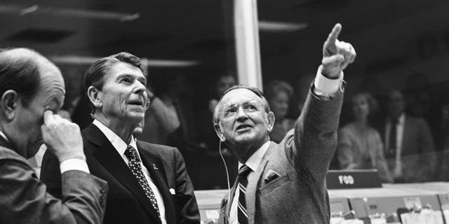 Then-President Ronald Reagan being briefed by Kraft in Johnson Space Center's Mission Control Center in Houston, in November 1981.