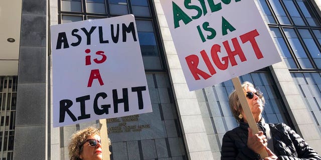Protestors holding signs that read "Asylum is a Right" outside of the San Francisco Federal Courthouse on Wednesday.