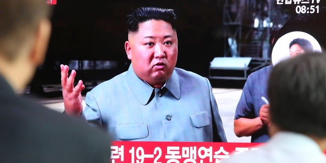 People watching a TV showing a file image of North Korean leader Kim Jong Un during a news program at the Seoul Railway Station in Seoul, South Korea, Thursday. (AP Photo/Ahn Young-joon)