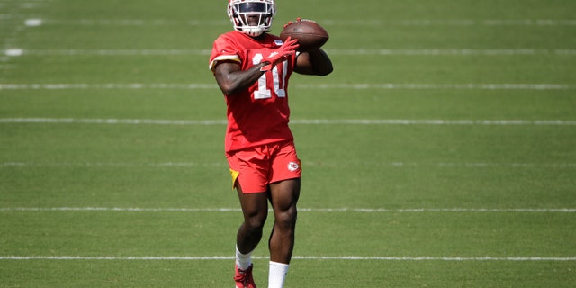 Kansas City Chiefs wide receiver Tyreek Hill throwing the ball during NFL football training camp Saturday. (AP Photo/Charlie Riedel)