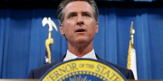 California Gov. Gavin Newsom during a news conference in Sacramento, Calif. Newsom signed a law Tuesday, July 30, requiring presidential candidates to release their tax returns to appear on the state's primary ballot, a move aimed squarely at Republican President Donald Trump.