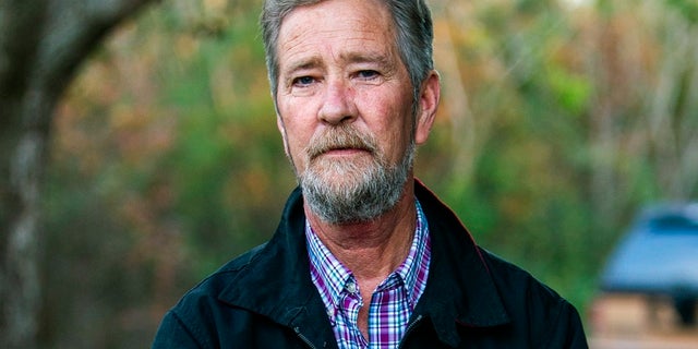 In this Dec. 5, 2018, photo, Leslie McCrae Dowless poses outside his home in Bladenboro, N.C. (Travis Long/The News & Observer via AP, File)