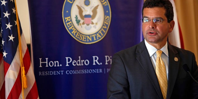 In this Sept. 24, 2013, photo, Pedro Pierluisi, Puerto Rico's representative in Congress, speaks during a conference in San Juan, Puerto Rico. (AP Photo/Ricardo Arduengo, File)
