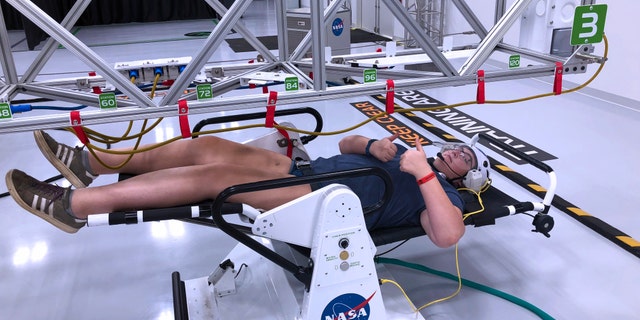 Microgravity "space walk" during the astronaut training experience at Kennedy Space Center. (Photo by Dave Parfitt)