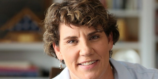 Fighter pilot Amy McGrath is the Democratic Party's choice to take on Sen. Mitch McConnell, R-Ky. But she faces a surging progressive primary opponent in state Rep. Charles Booker Tuesday. (McGrath campaign/Facebook)