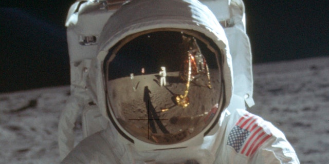 This detail of a July 20, 1969 photo made available by NASA shows astronaut Neil Armstrong reflected in the helmet visor of Buzz Aldrin on the surface of the moon. The astronauts had a camera mounted to the front of their suits, according to the Universities Space Research Association. So rather than holding the camera up to his eye, as we're accustomed to, Armstrong would have taken the photos from near his chest, which is where Armstrong's hands appear to be in his reflection.
