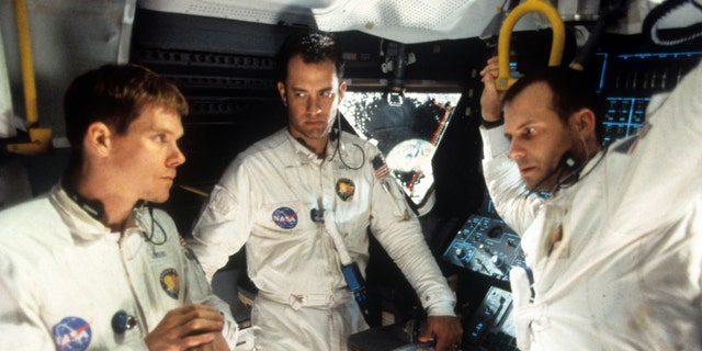 Kevin Bacon, Tom Hanks, and Bill Paxton, who portrayed Fred Haise, talking in ship in a scene from the film 'Apollo 13', 1995.