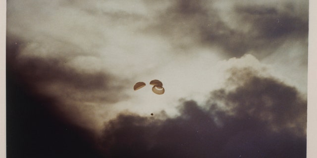 The Apollo 13 spacecraft parachutes to Earth, just before splashdown in the South Pacific Ocean after its aborted lunar landing mission, 17th April 1970. (Photo by Space Frontiers/Getty Images)