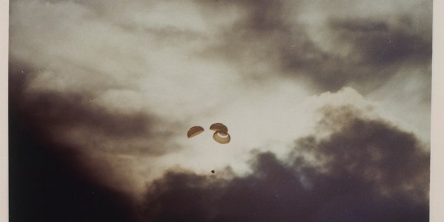 The Apollo 13 spacecraft parachutes to Earth just before the collapse in the South Pacific Ocean after the aborted lunar landing mission of April 17, 1970. (Photo by Space Frontiers / Getty Images)