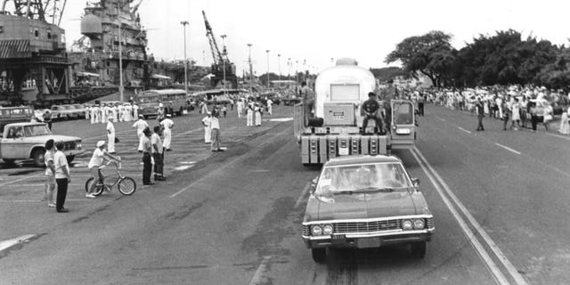 The MQF carrying the Apollo 11 crew is shown being transported to Hickam Air Force Base in Hawaii.