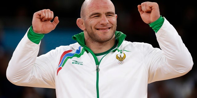 Taymazov won a total of three gold medals between 2000 and 2012. After being stripped of two for doping, he now holds one gold and one silver medal. (AP Photo/Paul Sancya, File)