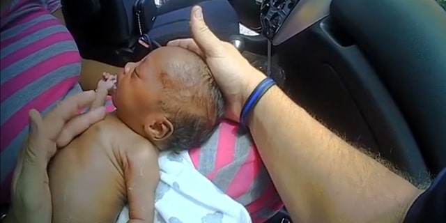 The infant can be seen making small movements and crying every so often but there is one point in the video where she appears to stop moving all together.